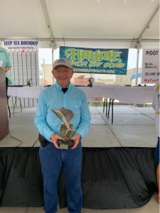 Mike Hagee holding his trophy